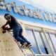 A worker installs wood shutters on a business in the Little Havana neighborhood of Miami. (Image: AP)